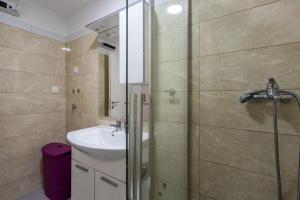 a bathroom with a shower and a sink at Apartments Sidro in Savudrija +46 photos