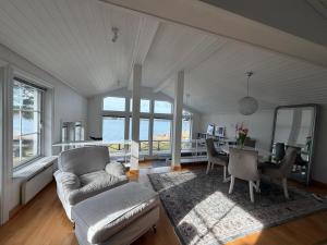 a living room with a couch and a table at Privat strandvilla i vackra Geta in Geta