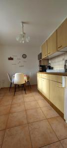 a kitchen with a table and chairs in it at Ferienhaus Greiling in Quedlinburg