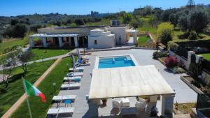 an aerial view of a house with a swimming pool at B&B Villa Vittoria Ostuni in Ostuni
