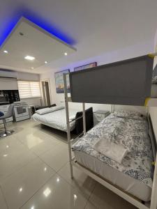 a bedroom with two bunk beds in a room at Perfect House in Eilat