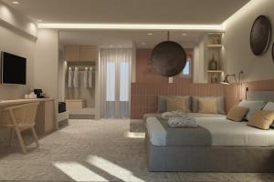 a bedroom with a bed and a living room at Aktaion Signature Suites in Skala +6 photos