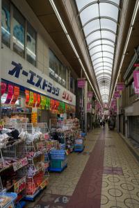 an aisle of a grocery store with a ceiling at Sumiyoshi Guesthouse 梦阁 粉浜の宿 in Osaka