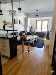 a living room with a couch and a table at Petar Apartment-City Center, Ohrid in Ohrid +7 photos