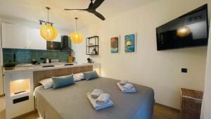 a bedroom with a bed with towels on it at Sunset Dream Suite El Cotillo in El Cotillo