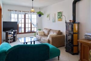 a living room with a couch and a table at Villa Sila in El Paso