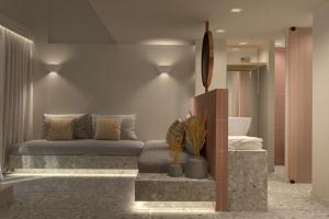 a living room with a couch and some plants at Aktaion Signature Suites in Skala