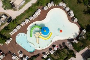 an overhead view of a water park with a swimming pool at Club del Sole Romagna Family Resort in Riccione