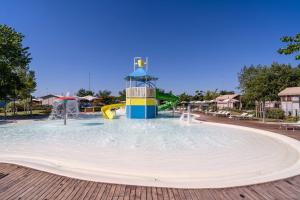 a water slide in a pool at a resort at Club del Sole Romagna Family Resort in Riccione