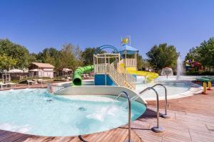 a water park with a water slide and a water fountain at Club del Sole Romagna Family Resort in Riccione