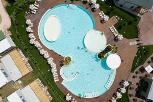 an overhead view of a swimming pool at a resort at Club del Sole Romagna Family Resort in Riccione