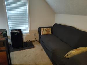 a living room with a couch and a window at Kings Bay Private Room Shared Bathroom D in Decatur