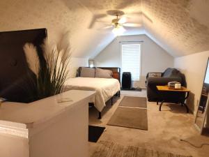 a living room with a bed and a couch at Kings Bay Private Room Shared Bathroom D in Decatur