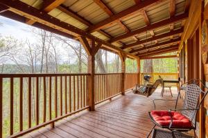 a screened in porch with a wooden roof at Pipers Place in Townsend