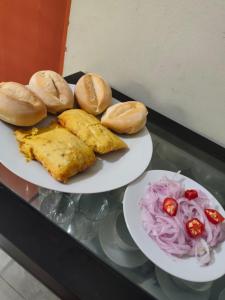 two plates of food on a glass table at Hotel Prince in Barranca