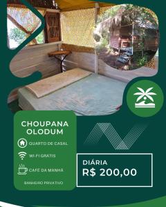 a poster for the dharma rps programme with a bed in a caravan at Choupana Olodum in Belém
