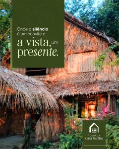 a house with a thatched roof with the words once a sisal at Choupana Olodum in Belém
