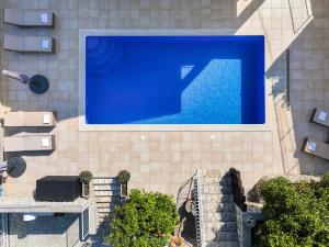 an overhead view of a swimming pool in a building at Apartment Paradiso - Ravni in Labin