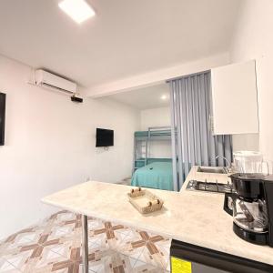 a kitchen with a table and a counter top at Apartamento Ulm in Flores
