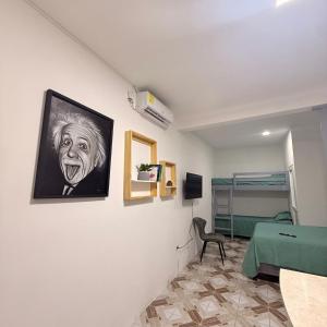 a room with a painting of a man on the wall at Apartamento Ulm in Flores