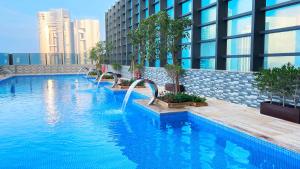 a swimming pool on top of a building at Southern Sun Abu Dhabi in Abu Dhabi