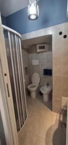 a bathroom with a toilet and a sink at Nel borgo San Francesco in Montesarchio