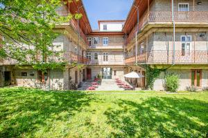 a large building with a lawn in front of it at HI Guimaraes - Pousada de Juventude in Guimarães