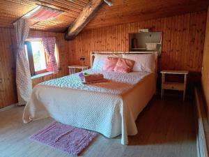 a bedroom with a bed in a wooden room at Affascinante Mansarda nel Cuore di Brunate in Brunate