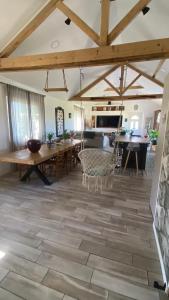 a large living room with a table and chairs at Maison de charme 3 chambres in Saligny-sur-Roudon