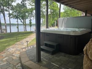 a large bath tub sitting on top of a patio at Wake N Lake in Littleton