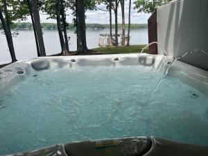 a jacuzzi tub with water coming out of it at Wake N Lake in Littleton