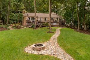 an aerial view of a house with a fire pit in the yard at Wake N Lake in Littleton +31 photos