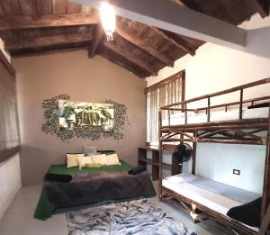 a room with two bunk beds in a room at AQUA CEIBA Hotel Spa Aventuras y Eventos in Jalcomulco
