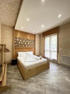 a large bedroom with a large bed and a window at Padova in Cedro in Padova
