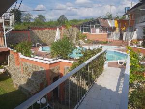 a view from the balcony of a house with a swimming pool at Casa hotel villadiana in Armenia