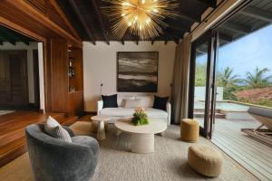 a living room with a couch and a table at Royal Isabela in Isabela
