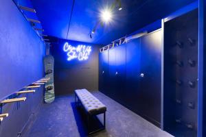 a locker room with a bench and a snowboard in it at Cesa del Volp in Canazei
