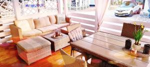 a living room with a couch and a table at Mobilheim Coco in Biograd na Moru