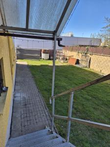 an outside view of a yard with a fence at Apartmán Na Blatech in Česká Lípa