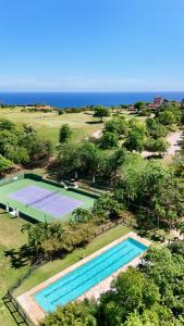an overhead view of a tennis court next to a golf course at Royal Isabela in Isabela +51 photos