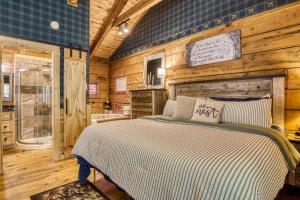 a bedroom with a bed and a wooden wall at Honeymoon Sweet in Townsend +27 photos