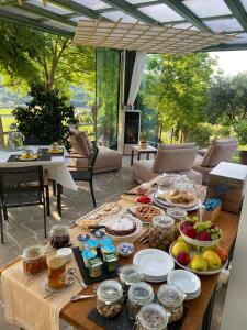 a table with food on it in a living room at B&B Ai Filari in Baone +30 photos