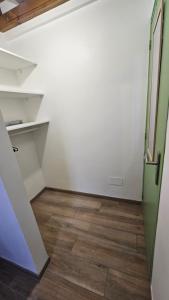 an empty room with a door and a wooden floor at Bibi Beach Sunrise in La Trinité +26 photos