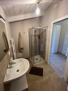 a bathroom with a shower and a sink at IL COLLE rooms in Lucca