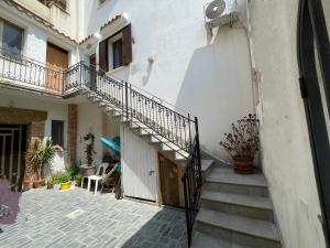 a stairway leading up to a building with a staircase at Grazia Vecchia 38 in Marsala