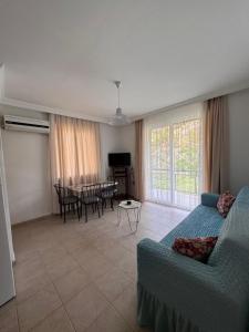 a living room with a couch and a table at Mermaid in Marmaris
