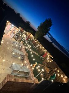 a building with lights on it at night at The Anchor Inn in Sutton Bridge
