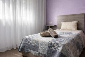 a bedroom with a bed with a shoe on it at Luxury Villa, 3 Levels, 5 bedrooms, 5 Baths, Pool & Garden in Tétouan