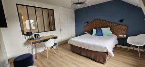 a bedroom with a large bed and a blue wall at Hotel le Broceliande - Sure Hotel Collection by Best Western in Bédée +78 photos