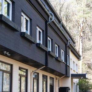 a house clad in black and white at Hotel Eifeltor in Mechernich